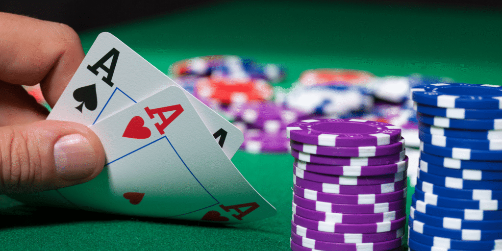 Showing Aces in Poker game poker chips around the table and cards